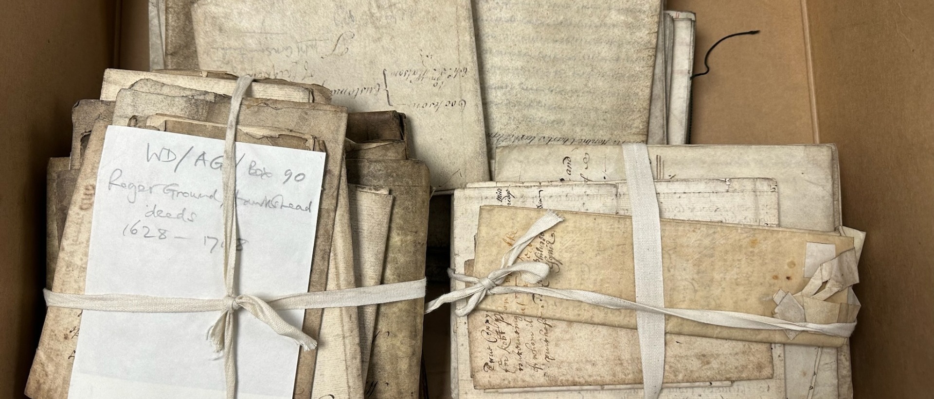 Historic Roger Ground deeds in a Cumbria County archive box